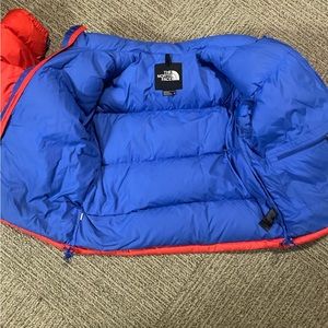 Blue and red northface jacket
